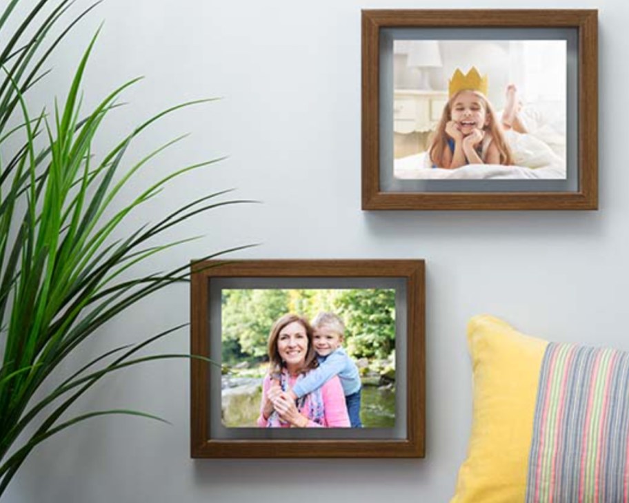 two brown floating frames on wall
