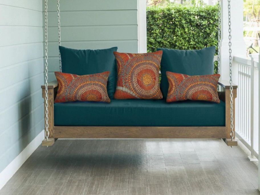 Abstract Indoor/Outdoor Throw Pillows on swing on porch