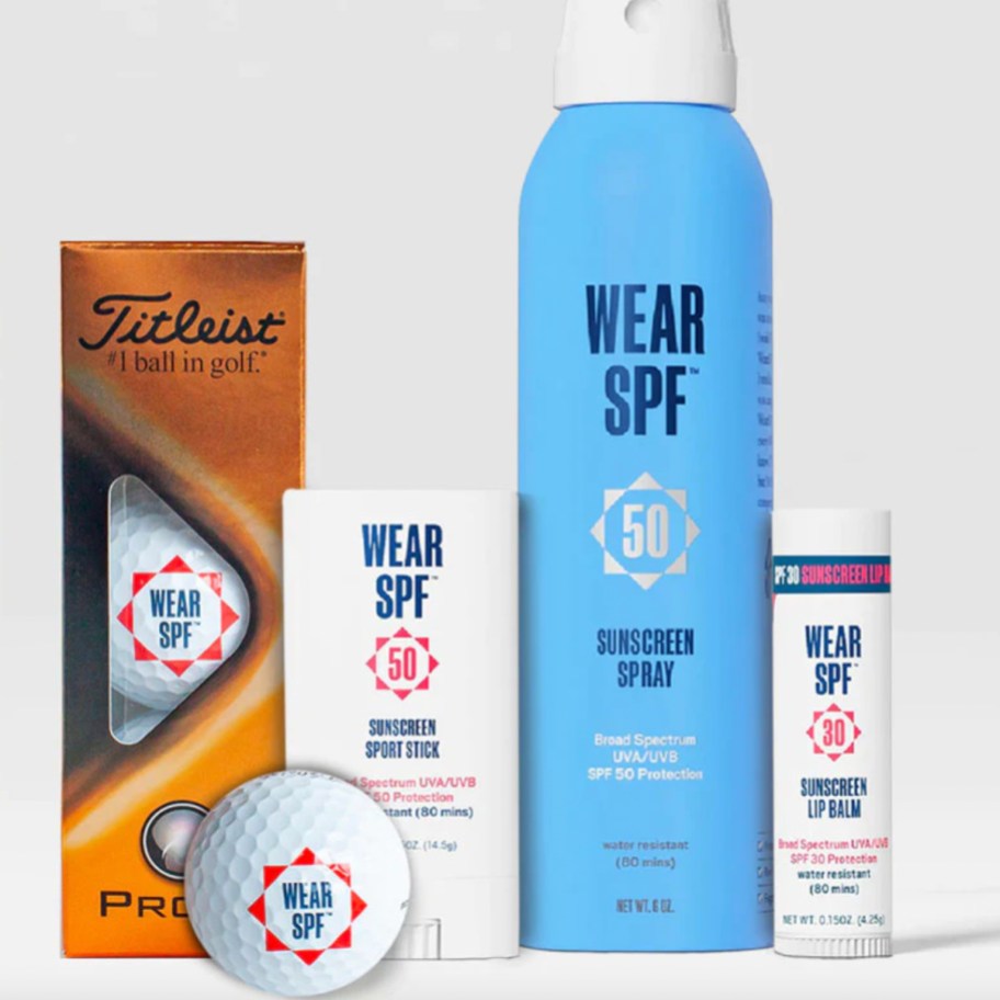 sunscreen spray, stick, chapstick, and golf balls