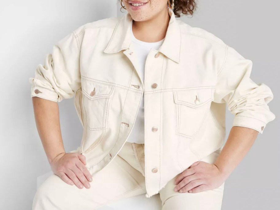woman wearing white jean jacket