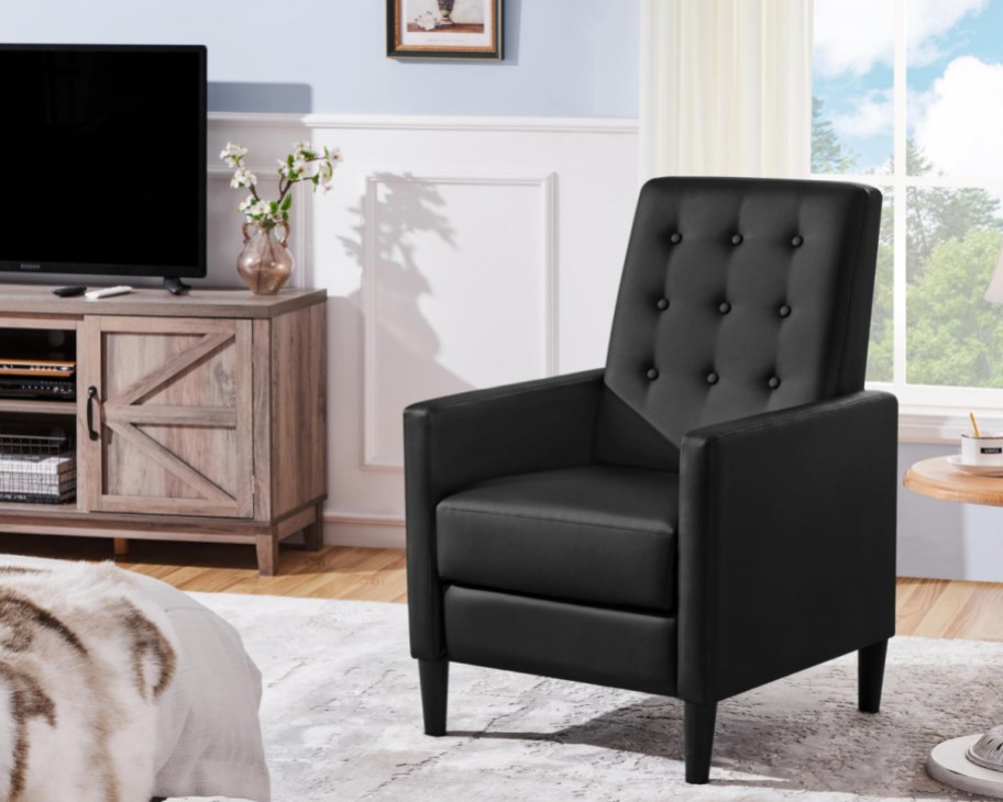 black faux leather recliner in living room