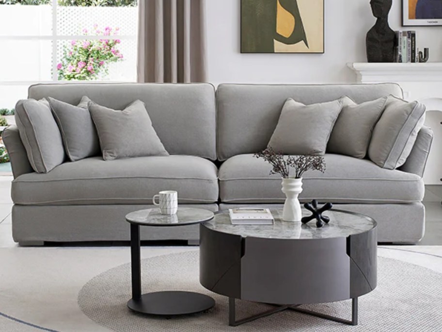 large grey loveseat in a casual style living room