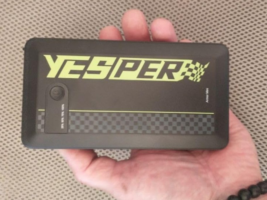 hand holding a Yesper battery charger jumpstarter