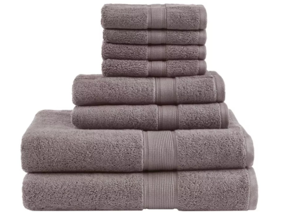 stack of 8 brown bath towels, hand towels and wash cloths