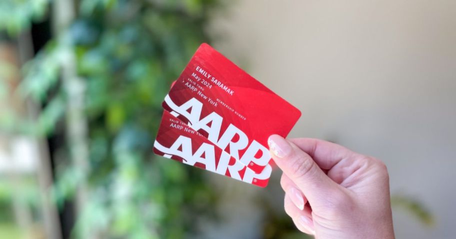 hand holding 2 AARP membership cards