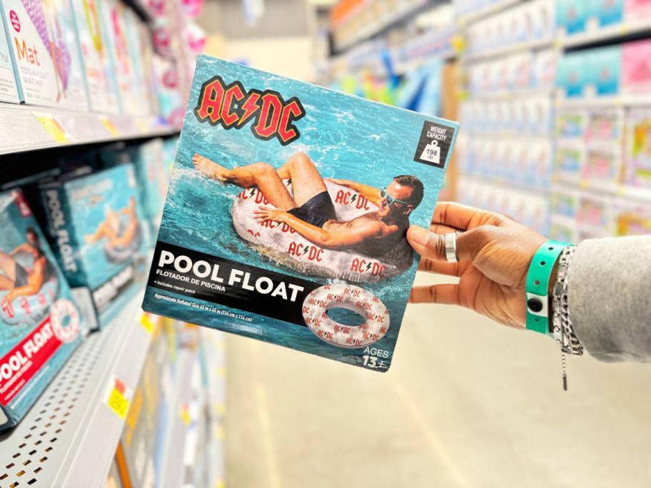 A hand holding a ACDC 40 inch Inflatable Swim Tube