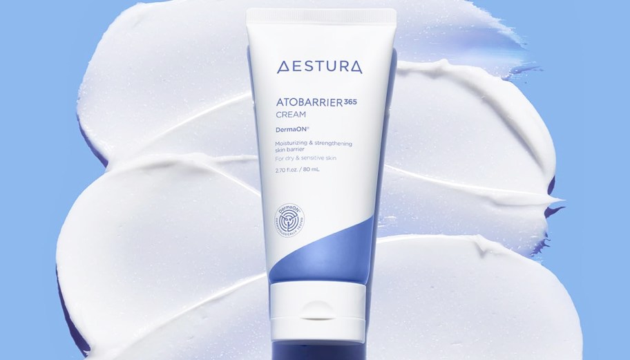 bottle of Aestura Autobarrier 365 Cream on top of white swatches