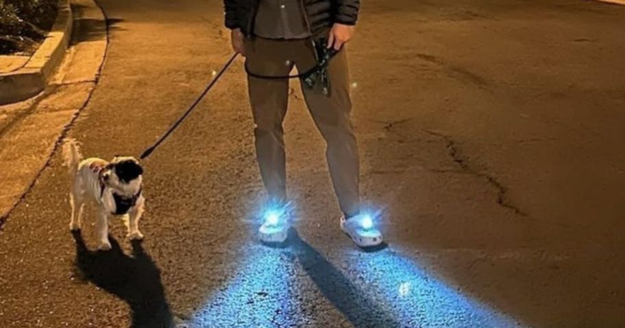 Man wearing battery Powered shoe lights on crocs while walking his dog at night