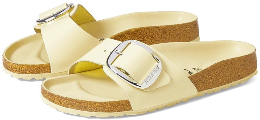 pair of light yellow birkenstock sandals