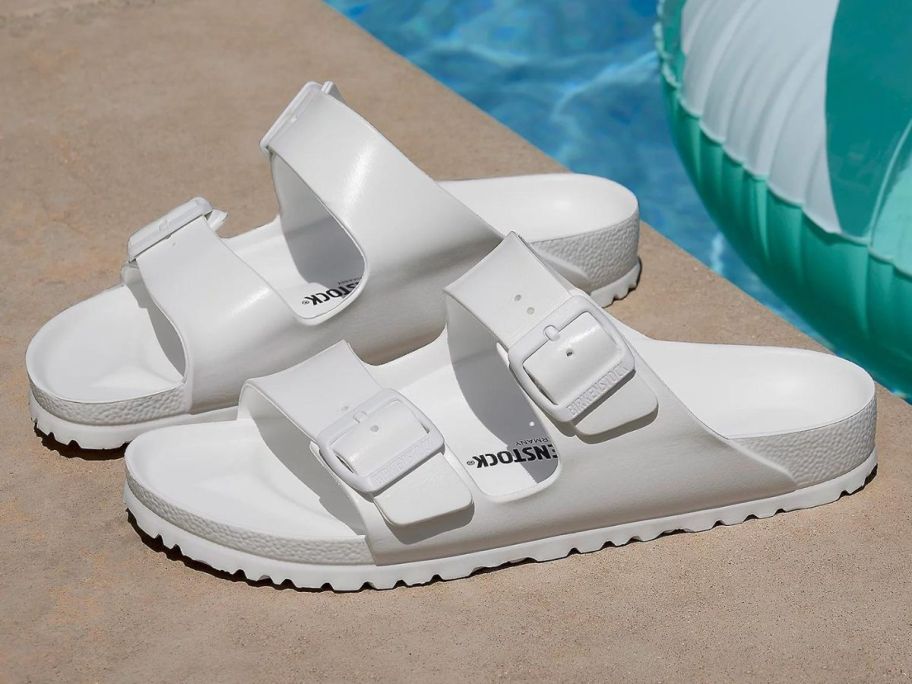 A Pair of Birkenstock Arizona Sandals by a pool