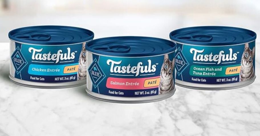three Blue Buffalo Tastefuls Natural Pate Wet Cat Food Variety Pack 3oz cans on kitchen counter