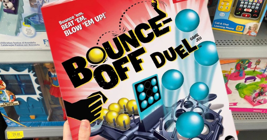hand holding up bounce off duel game box in store