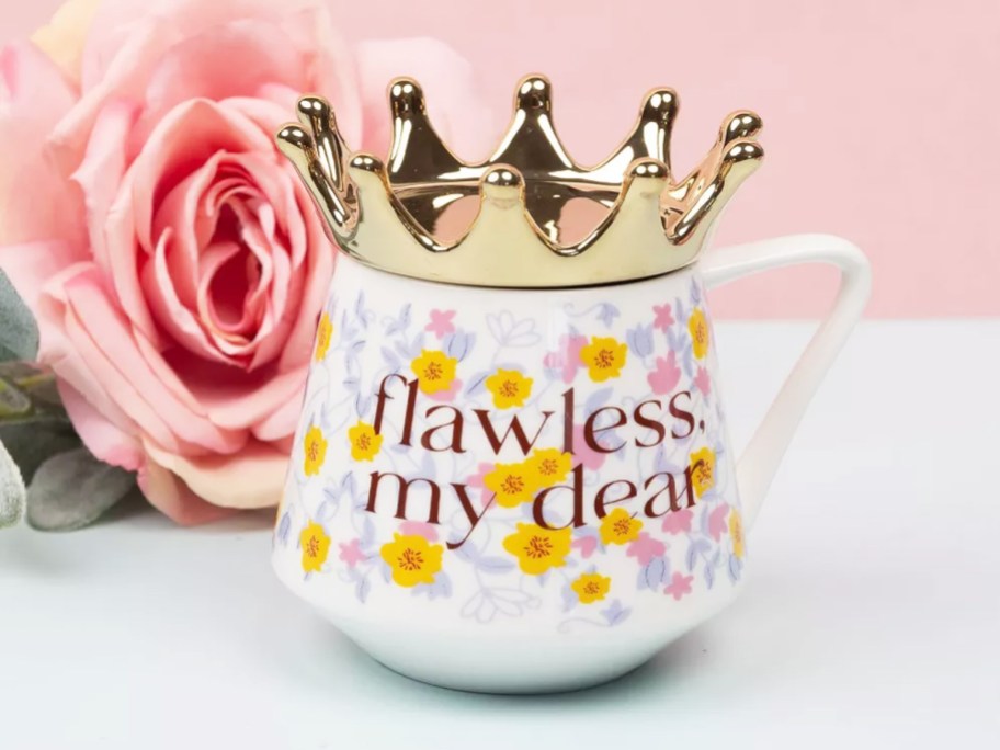 white floral print mug that says flawless my dear with gold crown on top