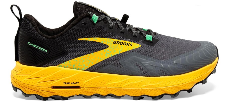 black, grey, and yellow brooks running shoe