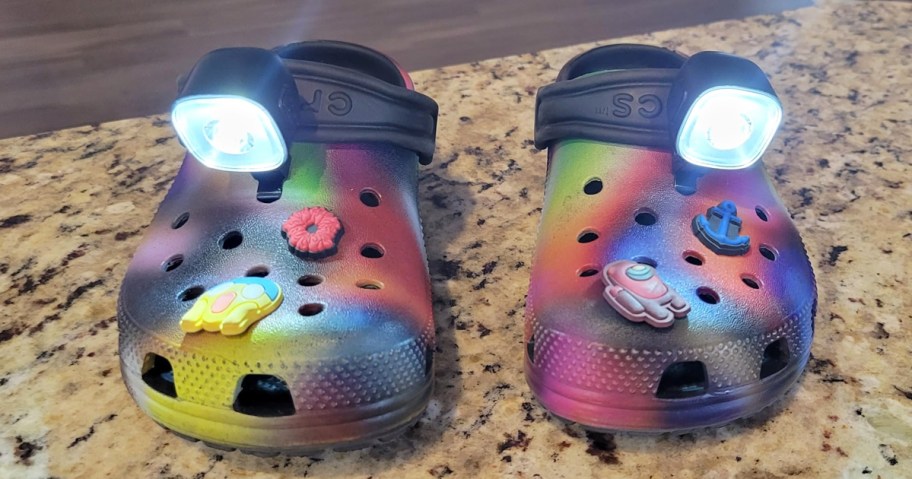 shoe lights clipped onto a pair of colorful crocs