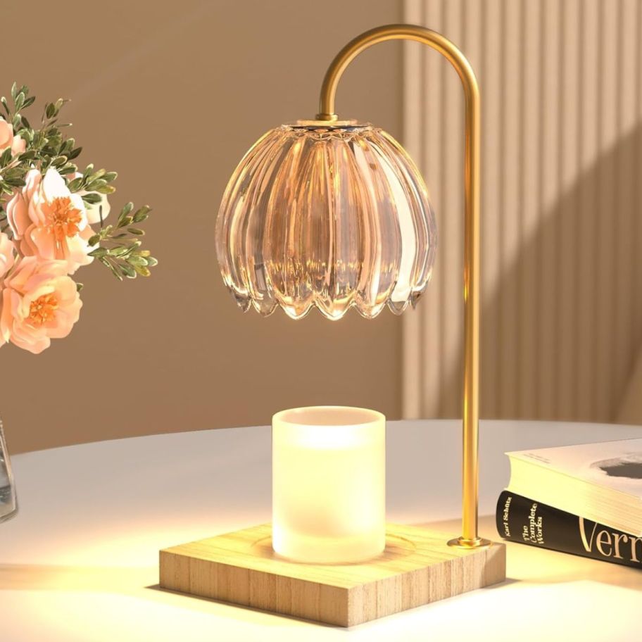 a candle warmer lamp with a round glass shade