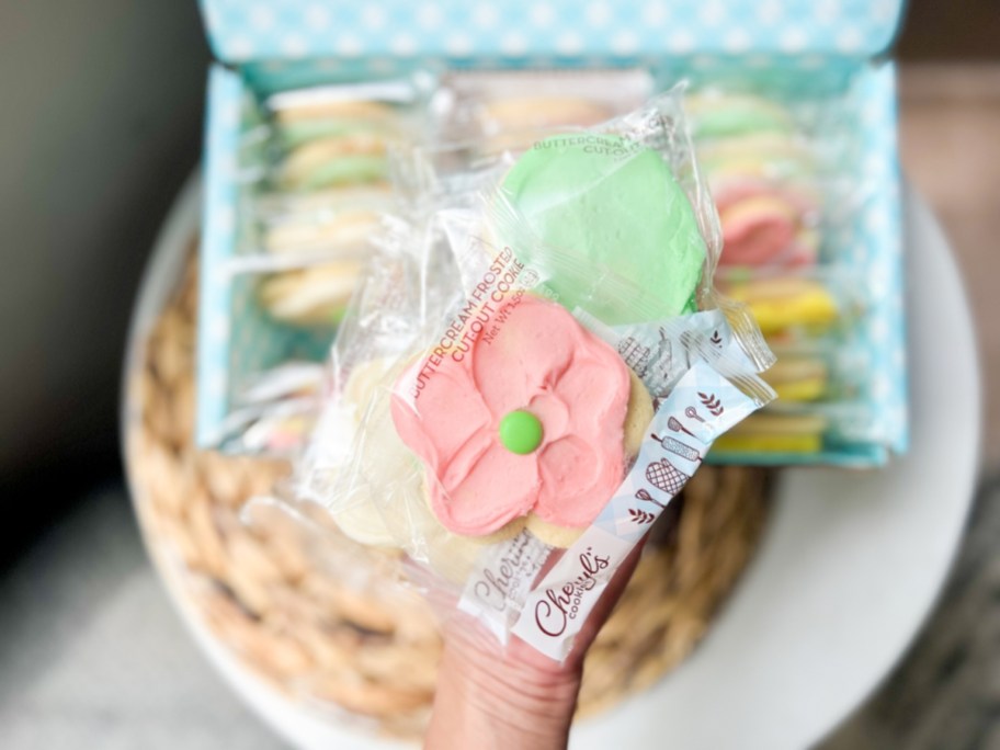 hand holding individually wrapped cheryl's cutout cookies