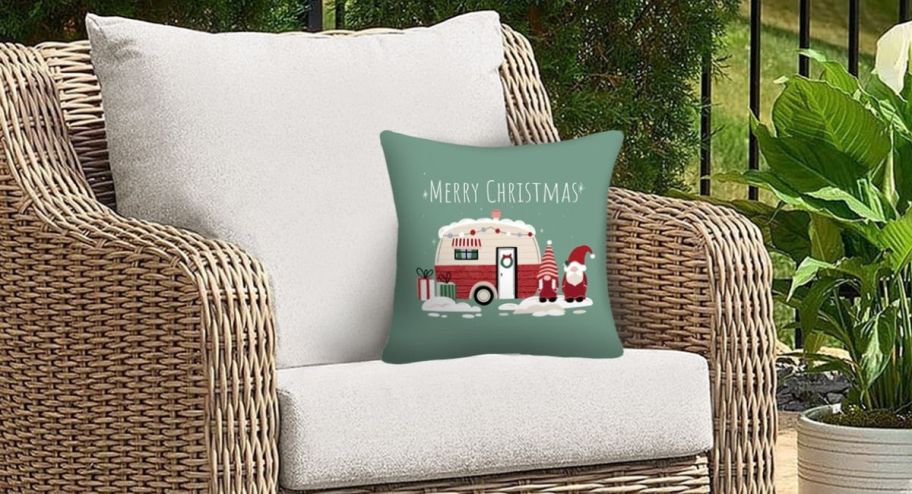 Chrostmas outside throw pillows displayed on a chair