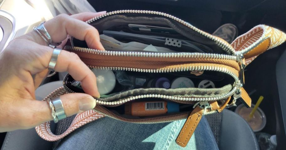 A leather belt bag unzipped
