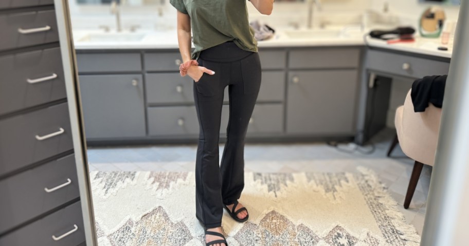 woman wearing aerie flare leggings in black