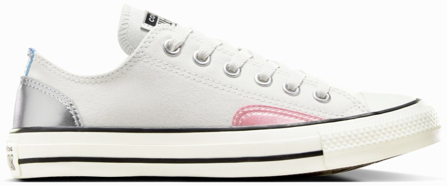 white low top converse sneaker with metallic pink and silver patches