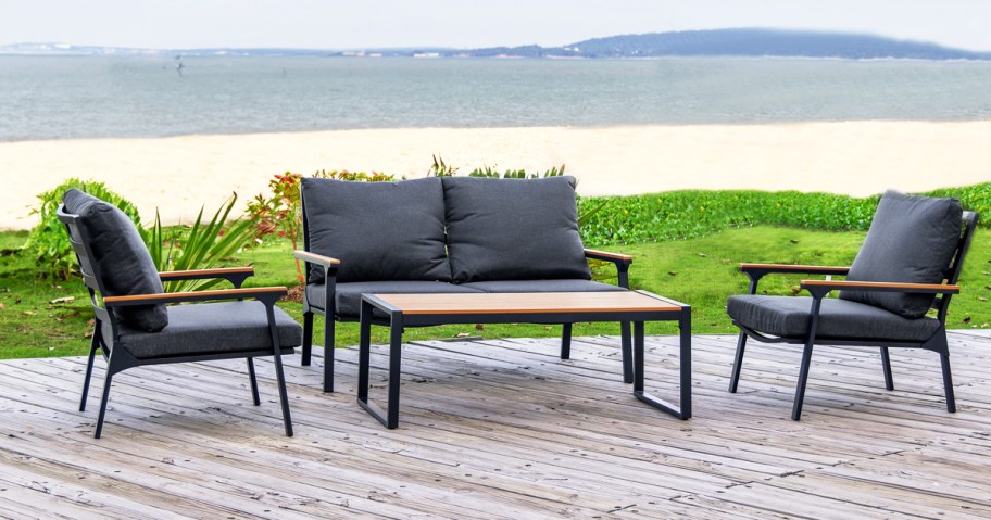 loveseat and two matching chairs with grey cushions and matching coffee table