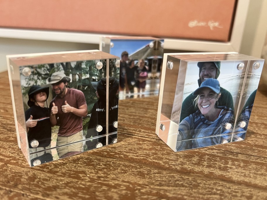 Display of three acrylic cubes on top of a table