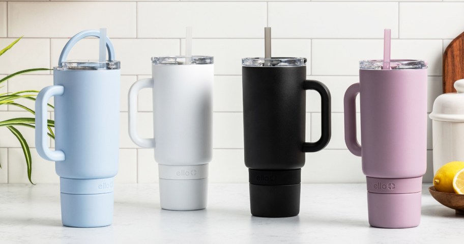 blue, white, black, and purple tumblers on kitchen counter