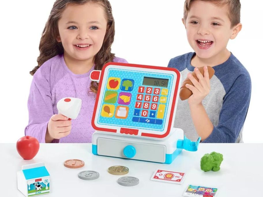 two kids with a Fisher Price Cash Register