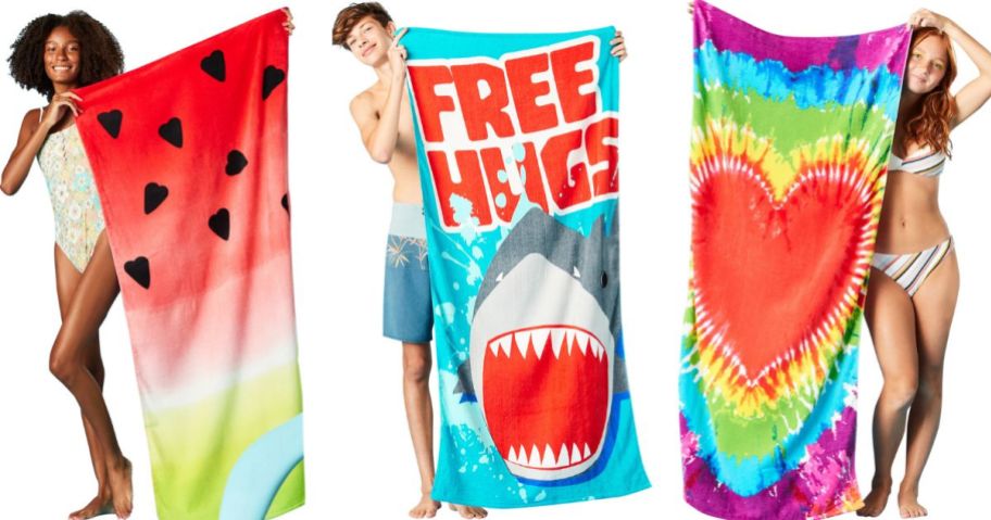 Stock images of 3 kids holding five below beach towels