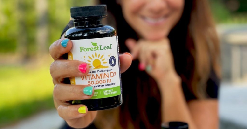 woman holding bottle of Forest Leaf Vitamin D3