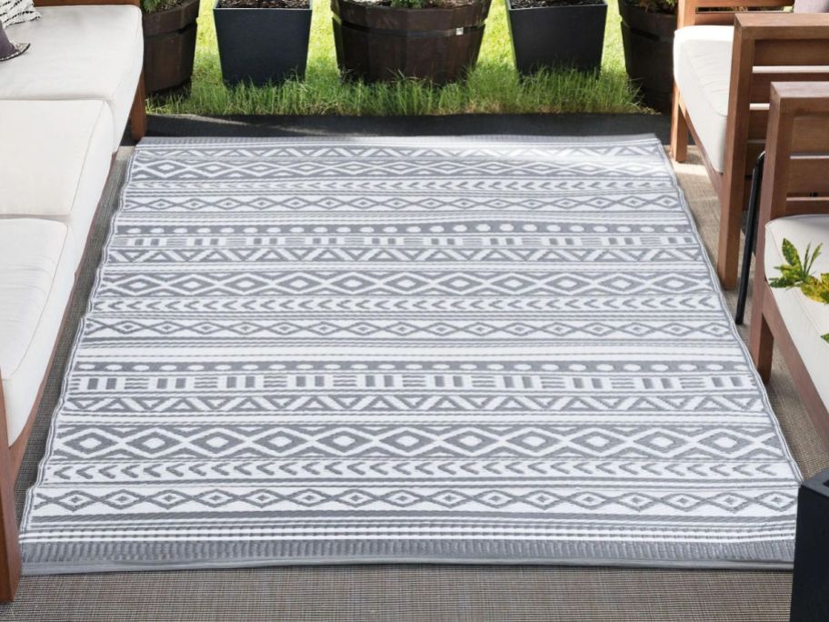 A gray and white George Oliver Makenna Moroccan Rug