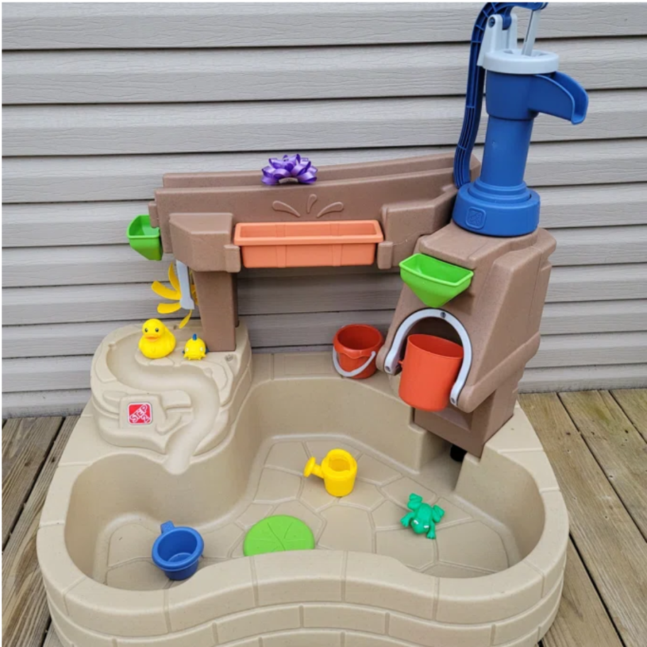 kid's water table, splash pond play set on a back deck