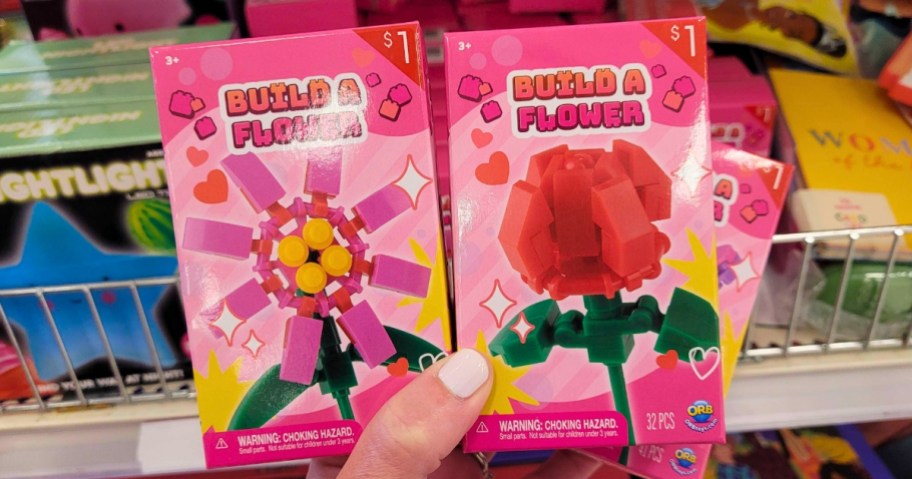 hand holding 2 different Flower Building Block Kits