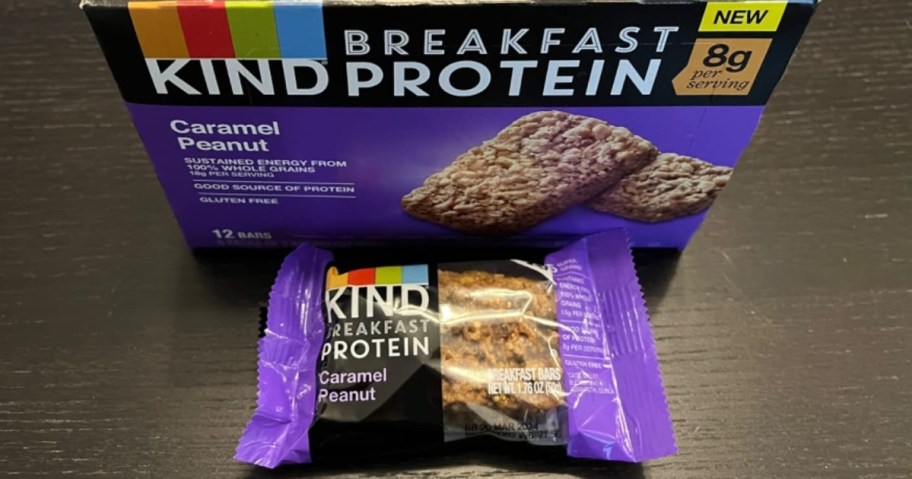 box of KIND Breakfast Protein Bars, Caramel Peanut with 1 individual wrapped bar pack in front of it