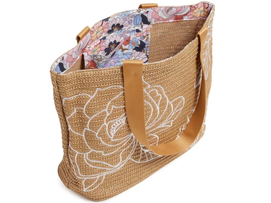 vera bradley tote bag with tan woven exterior and floral liner