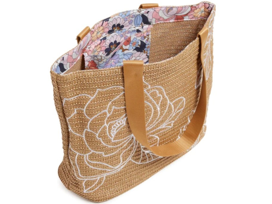 vera bradley tote bag with tan woven exterior and floral liner