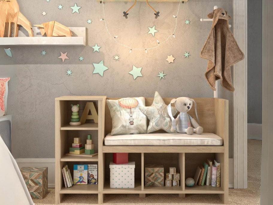 kid's storage cubby, bench and coat rack furniture piece in a kids room with toys and other items