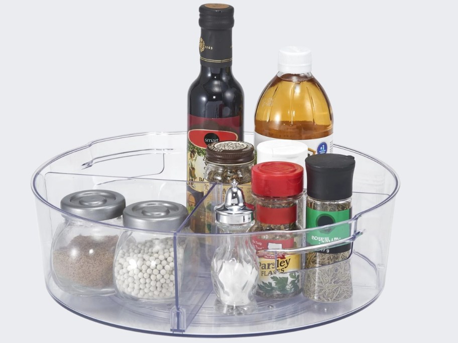 clear plastic turntable organizer with food in it