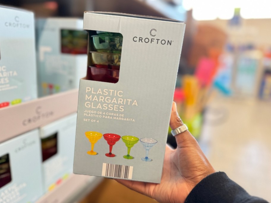 hand holding a box with Plastic Margarita Glasses