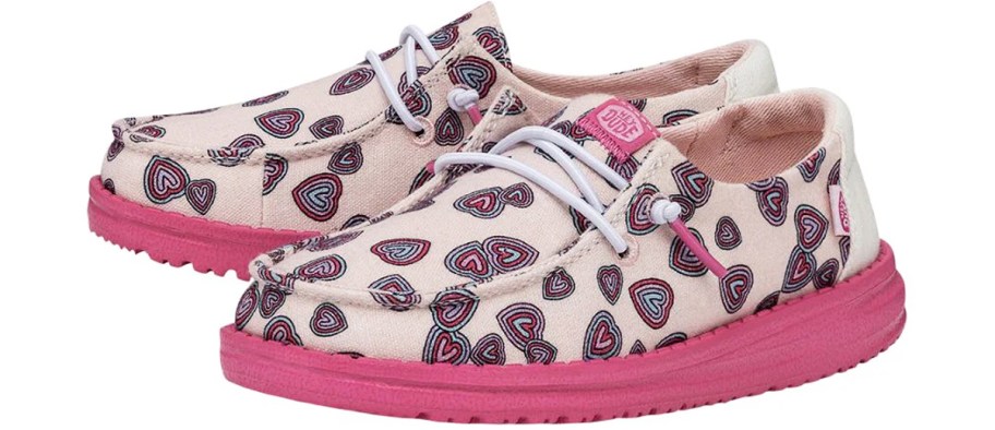 pair of pink heart print sneakers