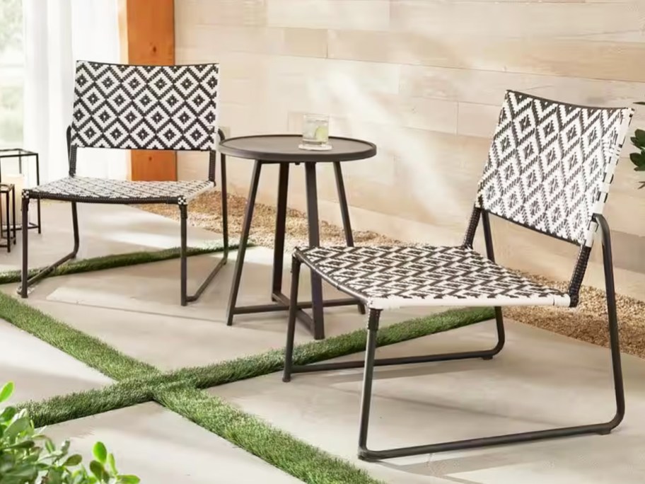 white and black wicker chairs with bistro table on patio