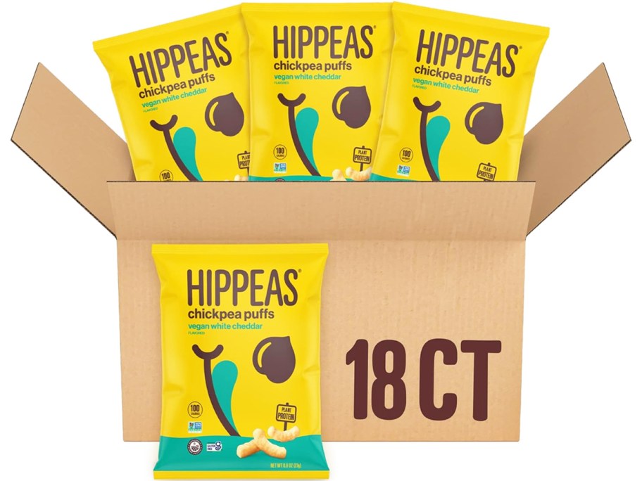stock image of cardboard box of yellow bags of Hippeas Chickpea Puffs