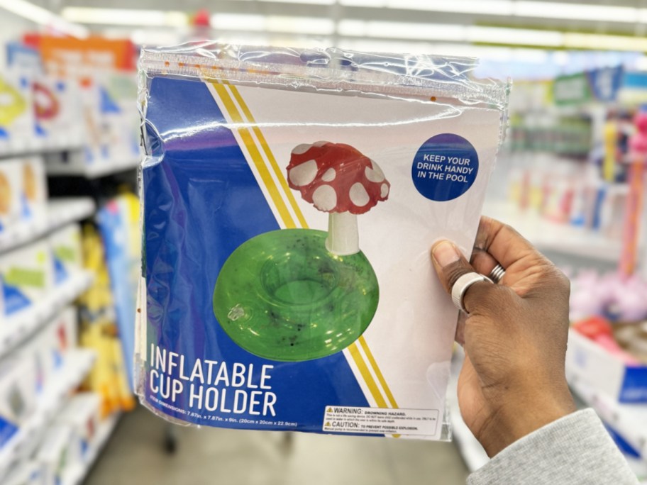 hand holding up an inflatable mushroom cup holder