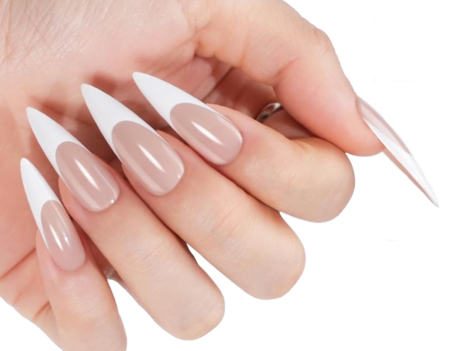 woman's hand with stiletto shaped french tip nails
