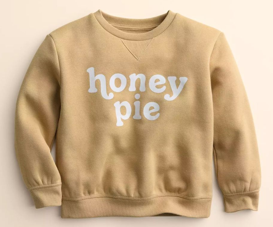 a kids graphic sweatshirt with the words honey pie across the front