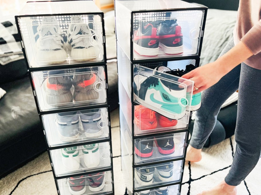 taking pair of air Jordan sneakers out of clear storage box