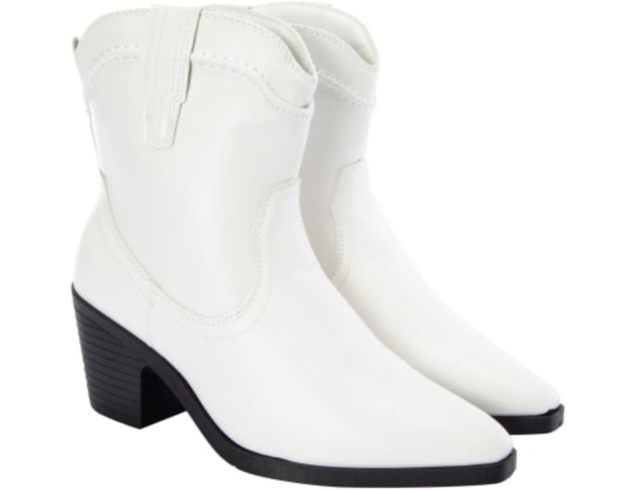 a pair of white cowboy style ladies ankle boots
