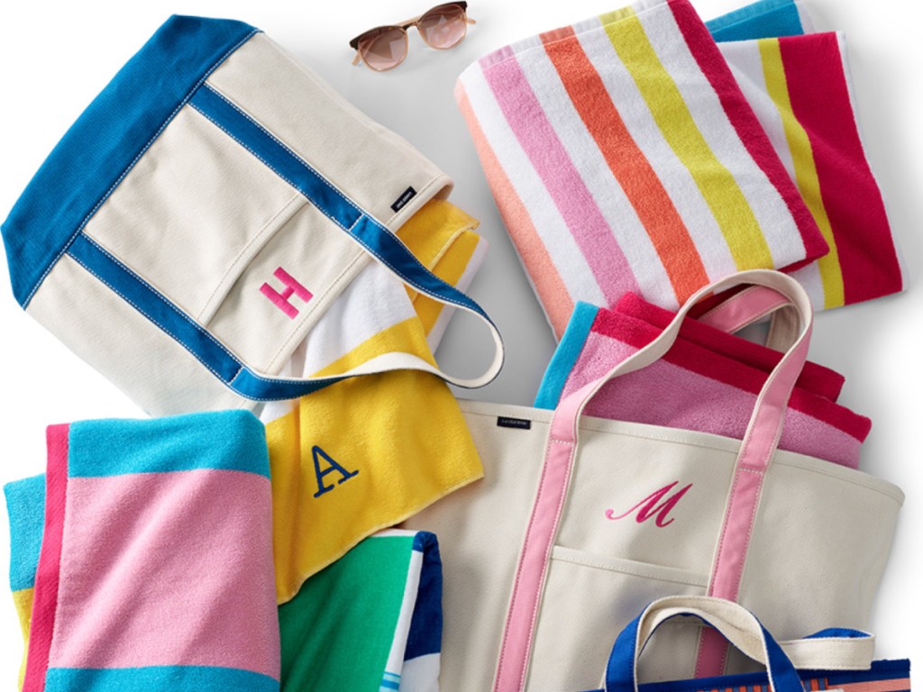 colorful tote bags surrounded by beach towels
