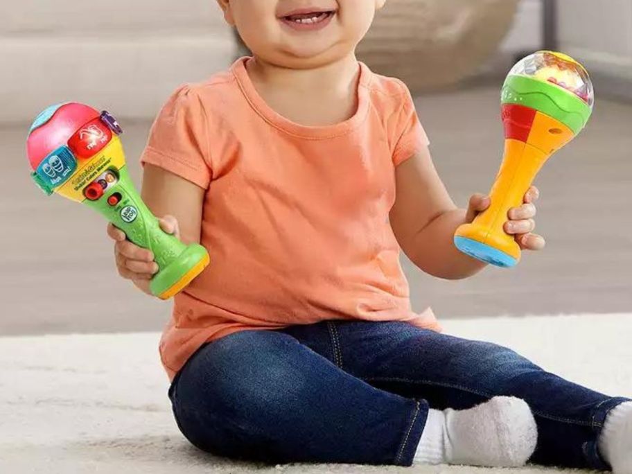 baby playing with LeapFrog Learn & Groove Maracas